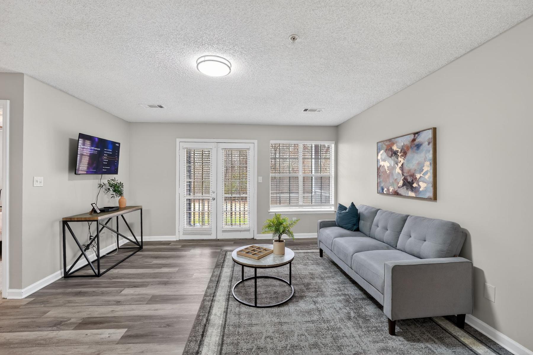 Living room of apartment 310 at Ballantyne Commons, Stockbridge